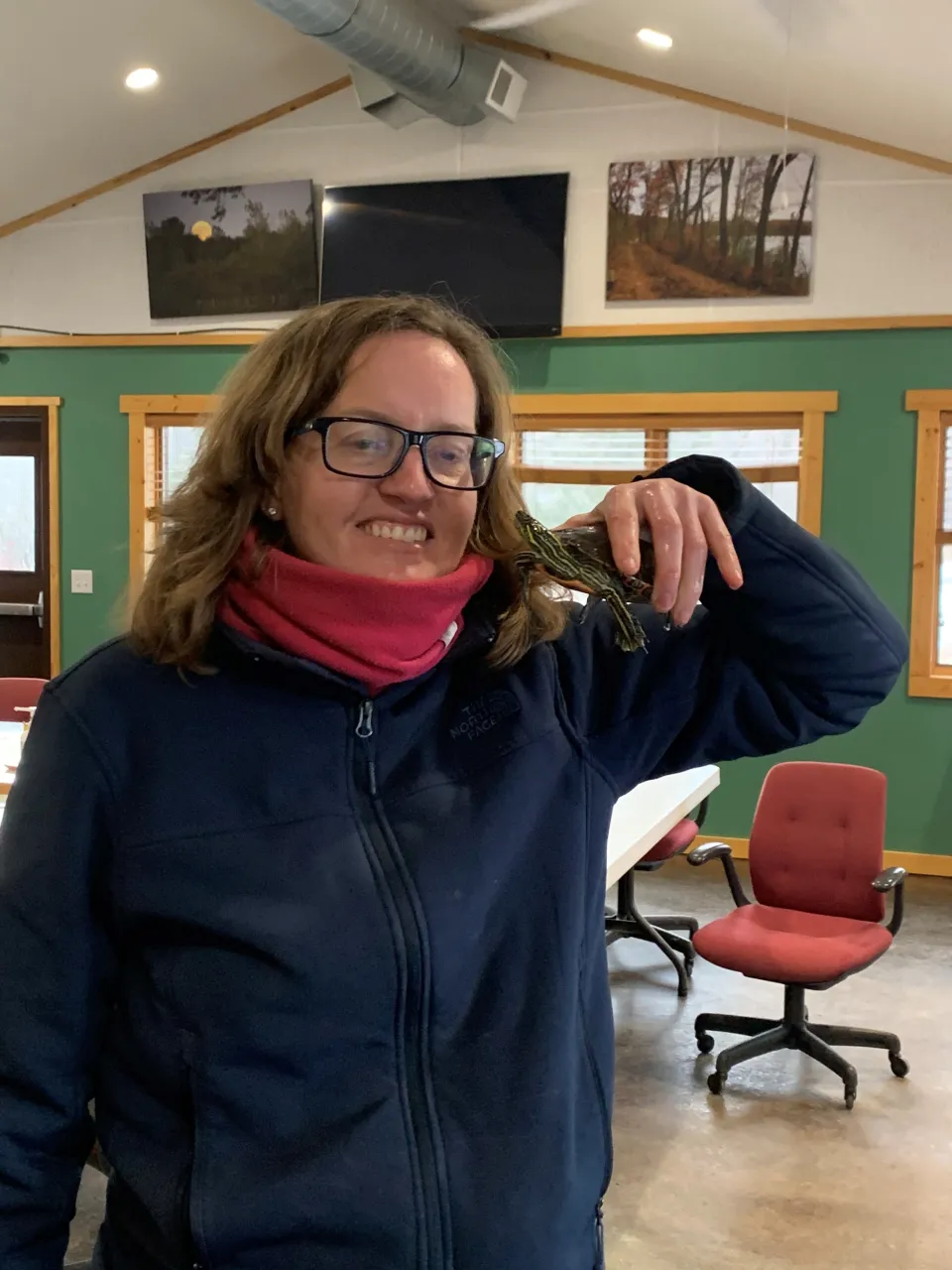 Chester Woods Park Volunteer Schalleen Nelson holding a turtle