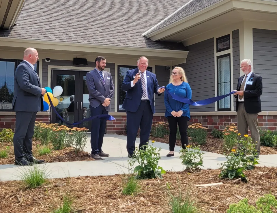 Minnesota Senator Dave Senjem cuts the ribbon for the Southeast Regional Crisis Center