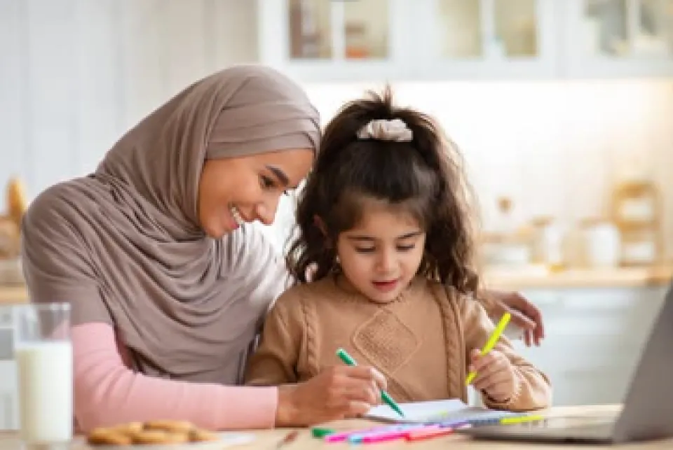 Mom and daughter working on homework