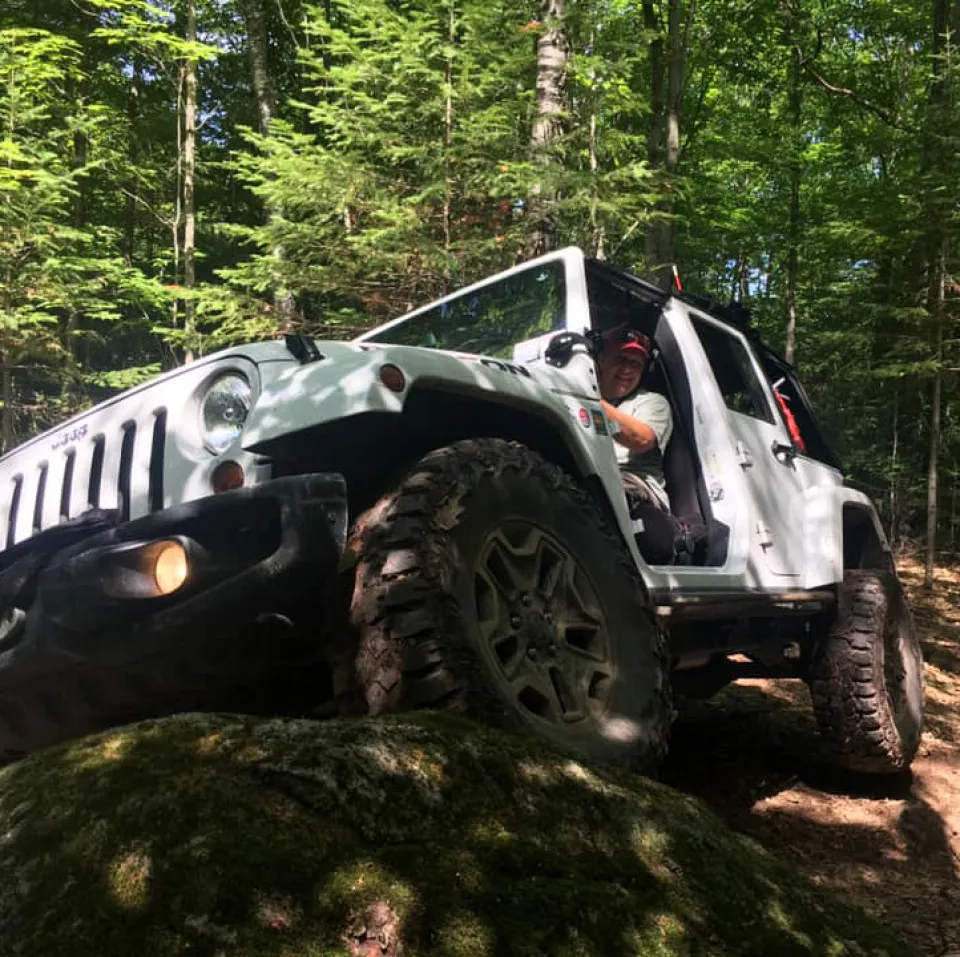 Mike Bromberg driving a jeep