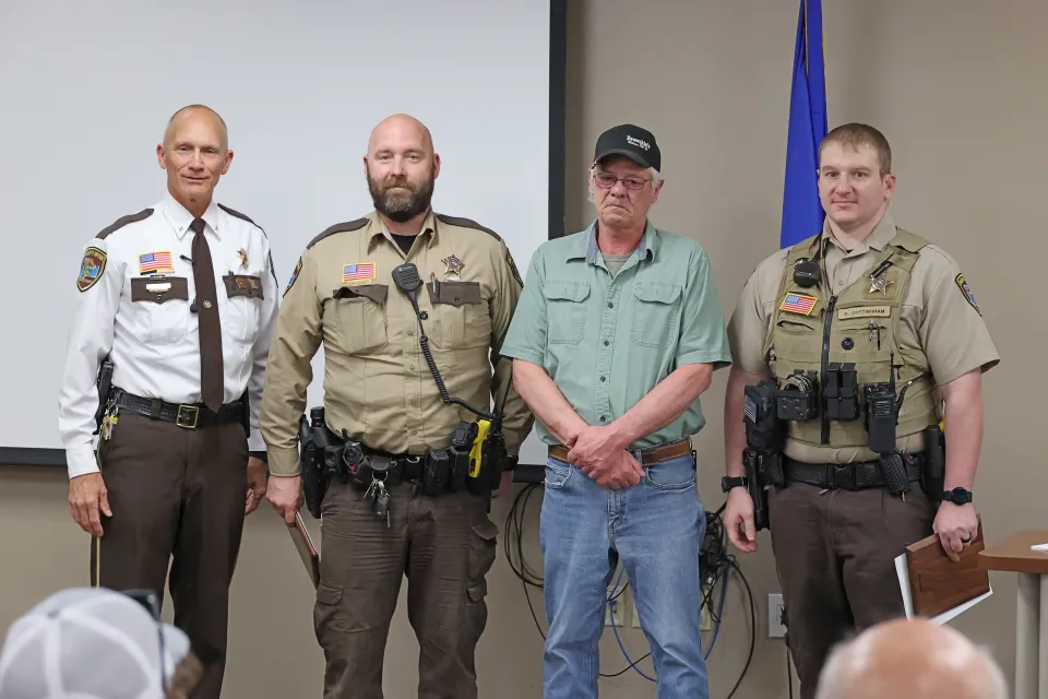 Sheriff Torgerson stands with deputies who receive life saving award