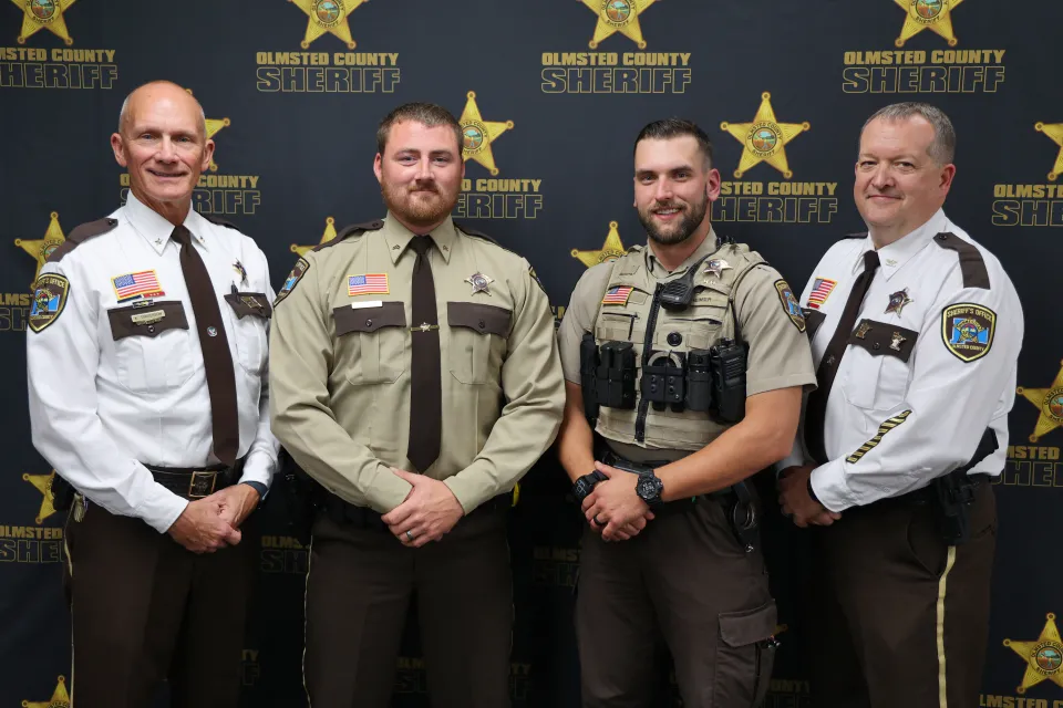 Sheriff Torgerson and Chief Deputy Howard with promoted corporals