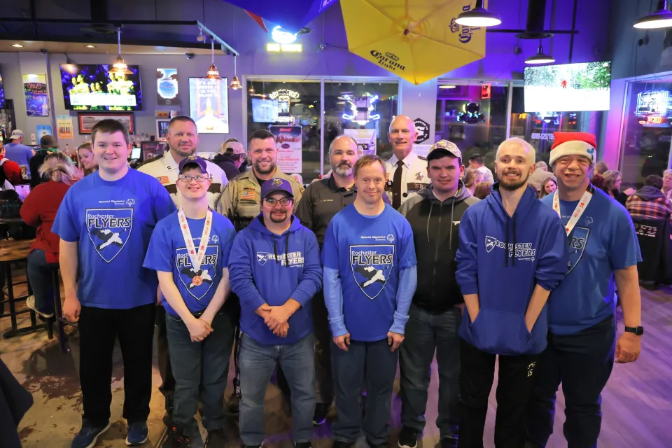 Group photo during Tip a Cop event at Glynner's in 2023