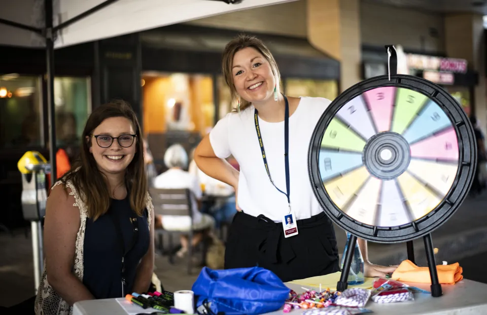 Two women at event booth