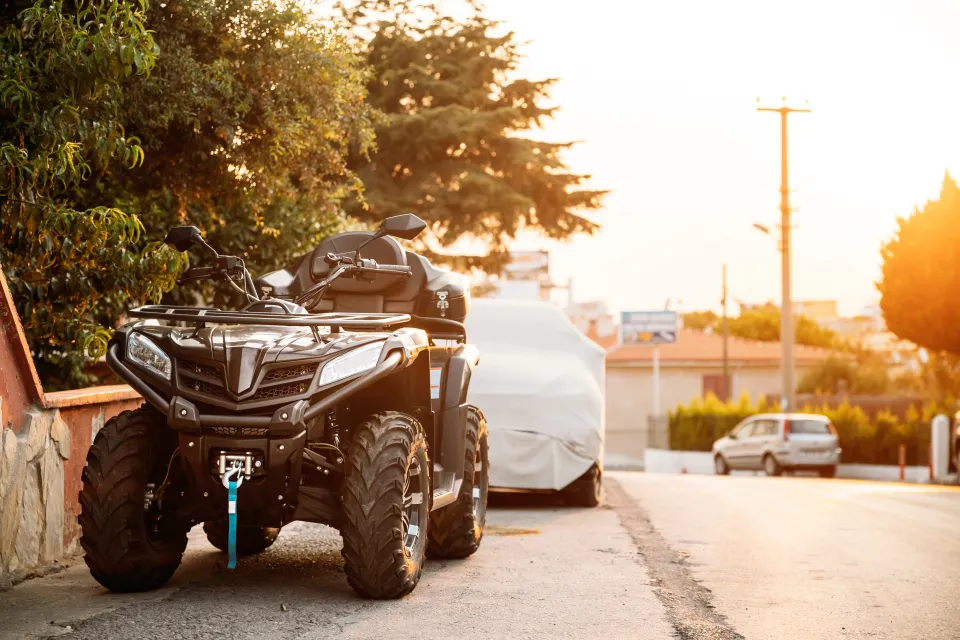 ATV 4-wheeler on the side of a street.