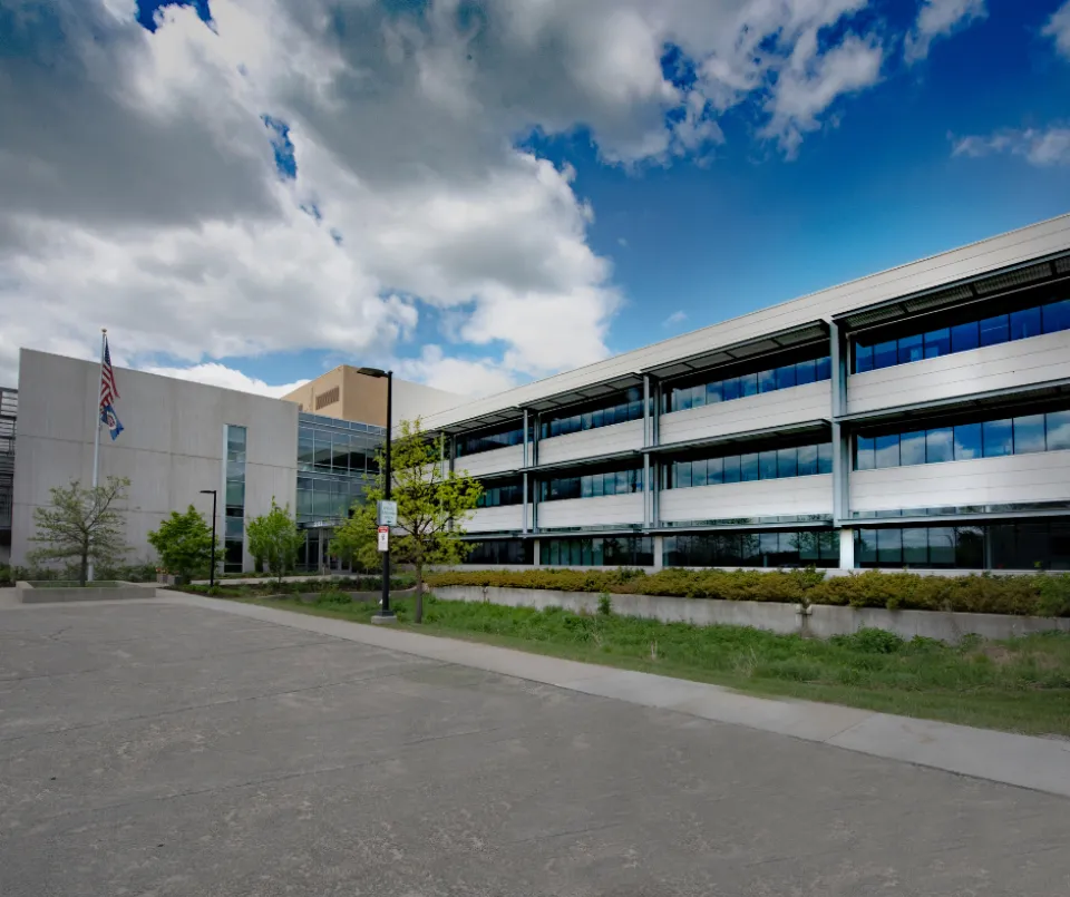 A picture of the 2117 building on a sunny day. Clouds in the sky.