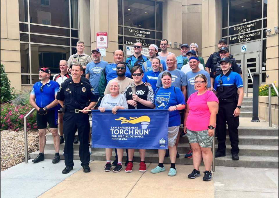 Group photo on the front steps of the Government Center after the Law Enforcement Torch Run.