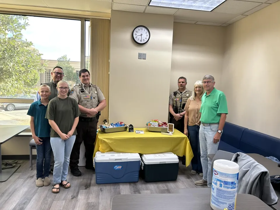 Group from Adult Detention Center poses for a photo with members of the Calvary Baptist Church after they dropped off treats for our staff