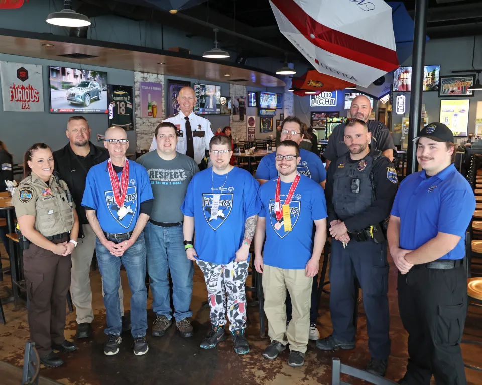 Sheriff's Office staff at Tip A Cop event with Special Olympics athletes