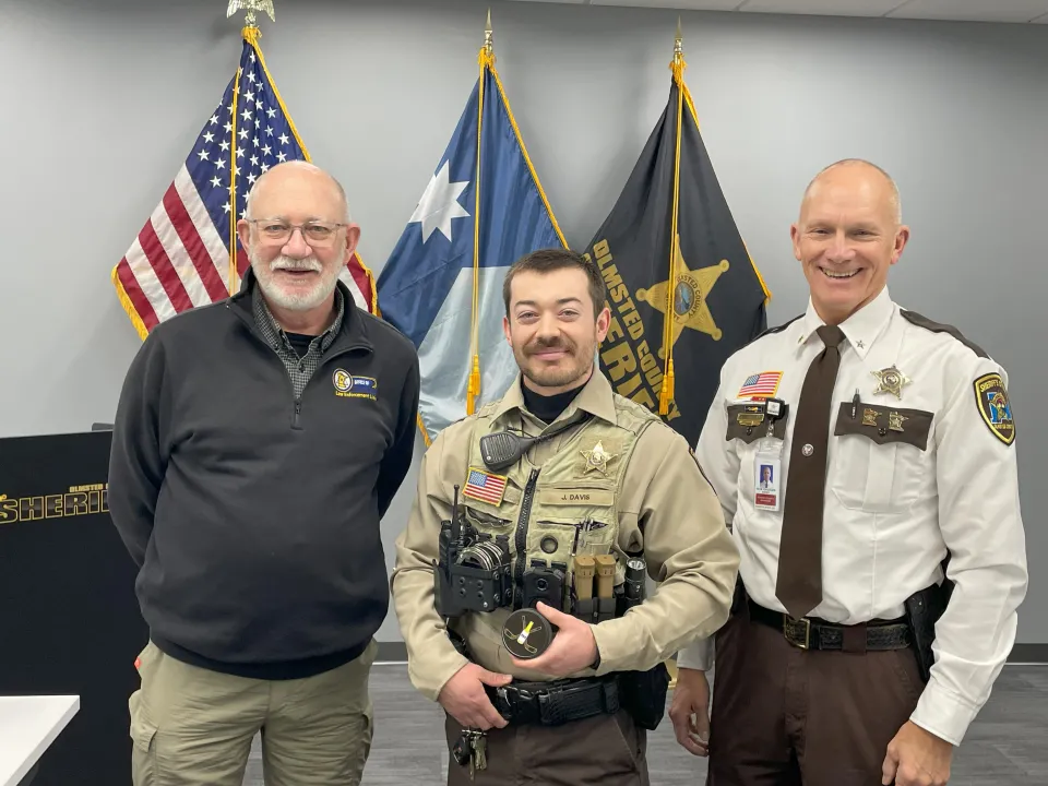 Deputy Jon Davis poses for a photo after receiving an award.