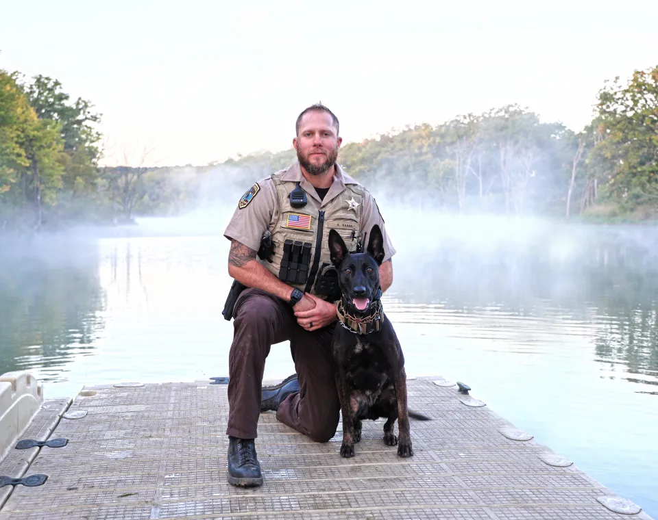 Deputy Kaase and K9 Athena on a dock at Chester Woods