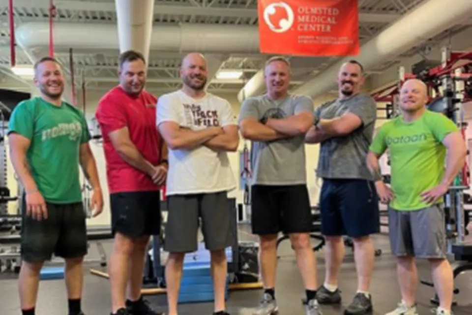 Group photo of Olmsted County Sheriff's Office staff following a workout