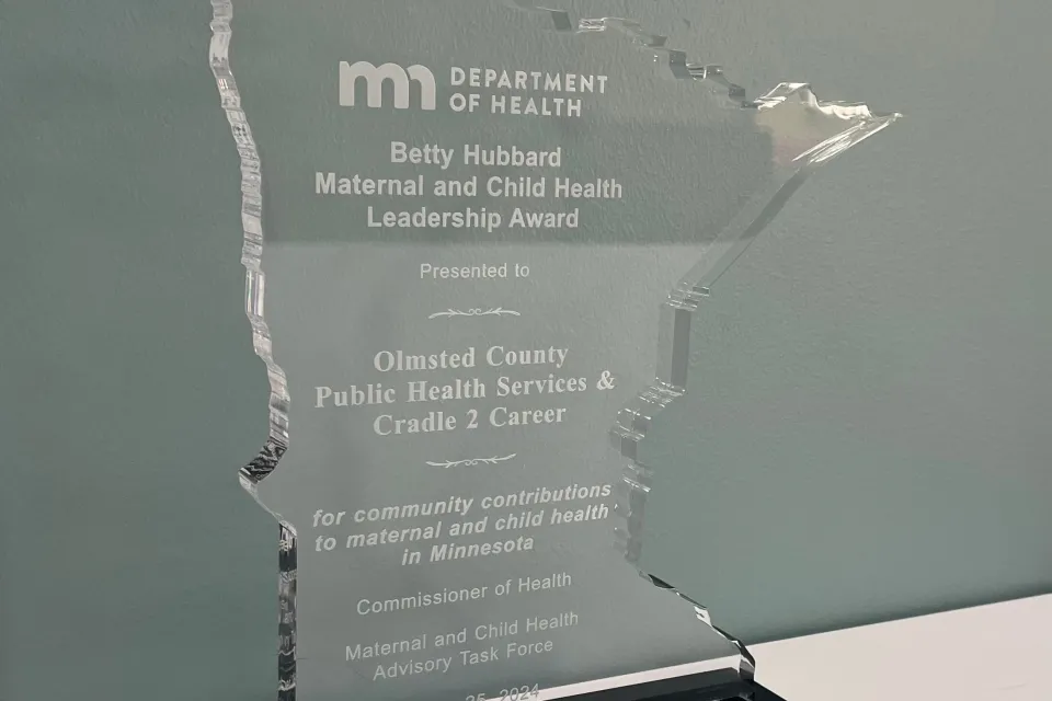 Award that reads Betty Hubbard Maternal and Child Health Leadership Award for Olmsted County Public Health Services and Cradle 2 Career.