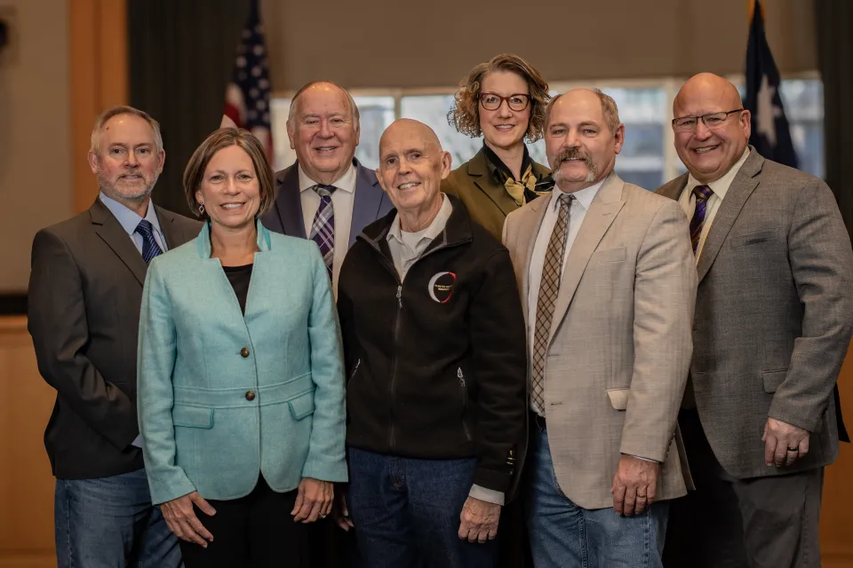 Group picture of Commissioners Bob Hopkins, Michelle Rossman, David Senjem, Gregory Wright, Laurel Podulke-Smith, Brian Mueller, and Mark Thein