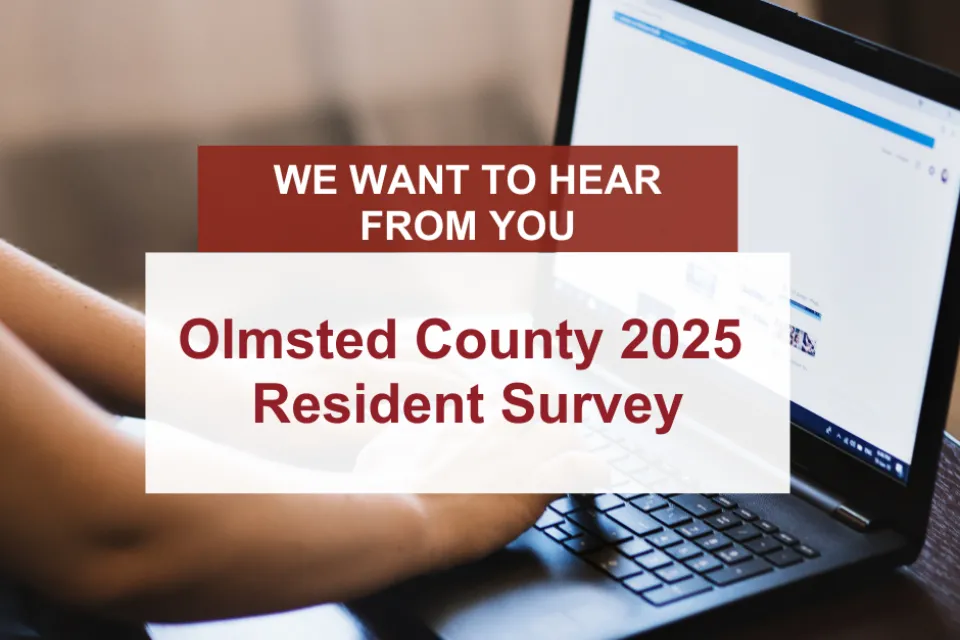 Hand typing on computer with Olmsted County 2025 Resident Survey overlay